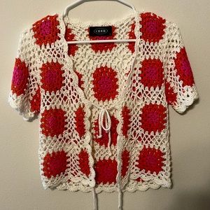 A Cider brand knitted, crop top that tie in the front.